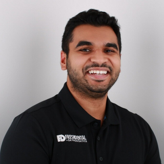 closed up portrait of Dr. Mehul Nathubhai working at Fresh Dental Orthodontics Longview, TX